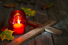 Cemetery Red Lantern Candle With Autumn Leaves In Night