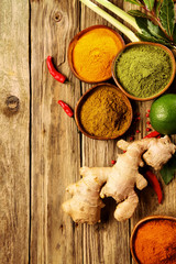 Wall Mural - Assorted dried ground spice with fresh ingredients