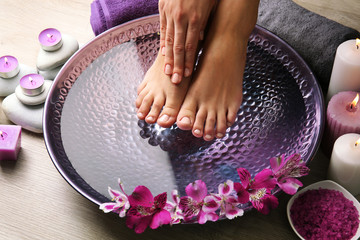 Canvas Print - Female feet at spa pedicure procedure