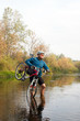 © vetal1983 - Young athlete crossing rocky terrain with bicycle in his hands