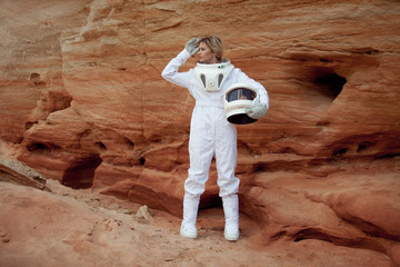 Wall Mural - futuristic astronaut without a helmet on another planet, image