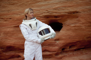 Wall Mural - futuristic astronaut without a helmet on another planet, image