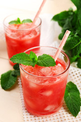 Wall Mural - Cold watermelon pieces in glasses, on wooden table background