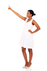 Wall Mural - black woman pointing at empty space