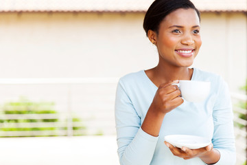 Wall Mural - young black woman having coffee