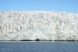 Close up of blue ice in the glacier by the sea, Svalbard