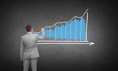 Wall Mural - businessman drawing diagram chart from back