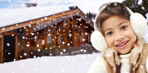 Wall Mural - happy little girl wearing earmuffs