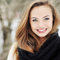 Beautiful young woman smiling - close up