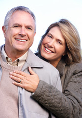 Poster - Happy senior couple in park.