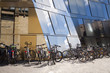 Bicycles on front of glass office building