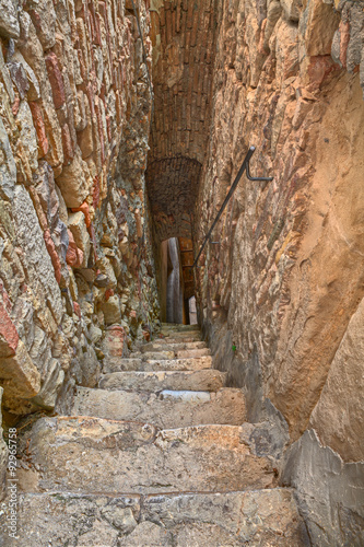 Naklejka na drzwi narrow and dark alley in Atessa, Abruzzo, Italy