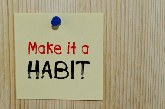 Wall Mural -  - Make it a habit written on paper note over wooden background