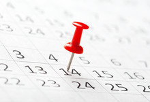 Concept Image Of A Calendar With Red Push Pins