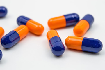 Blue and orange capsules