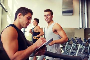 Canvas Print - men exercising on treadmill in gym