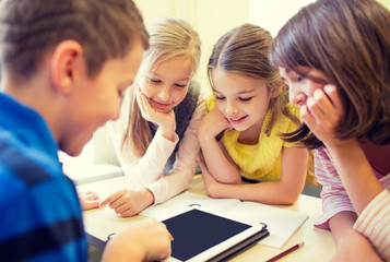 Sticker - group of school kids with tablet pc in classroom