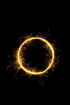 Sparkling circle isolated on black.