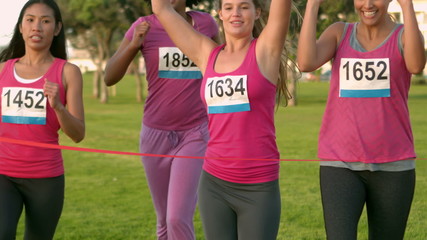 Wall Mural - Cheering women winning breast cancer marathon