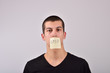 © axentevlad - teenager with stop note on his mouth