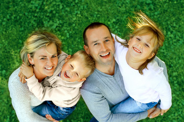 portrait of a happy family smiling a top view