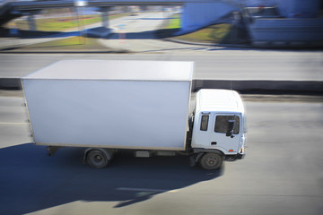 Wall Mural - truck driving on city street