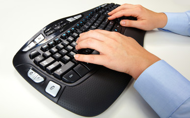 Wall Mural - Hands typing on computer keyboard.