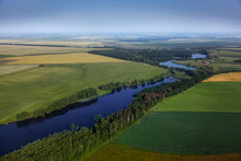 Aerial View Above The Green Fields And River