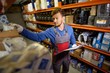 © Nejron Photo - Worker on a automotive spare parts warehouse