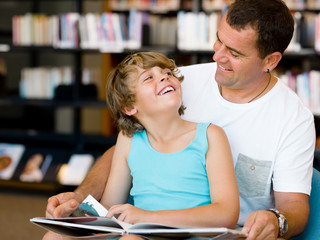 Father with son in library