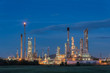 © weerasak - Oil refinery at twilight with sky background.