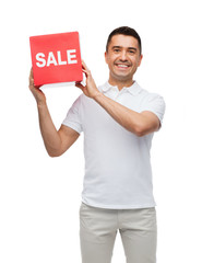 Wall Mural - smiling man with red sale sigh
