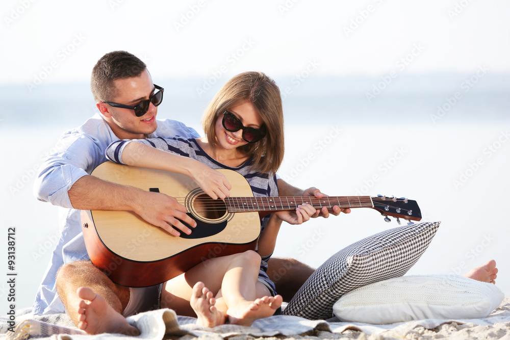 Young couple on the riverside