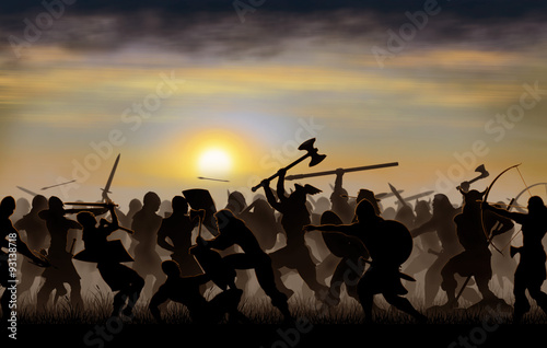 Cuadros en Lienzo silhouettes fighting warriors are seen against the background of the rising sun