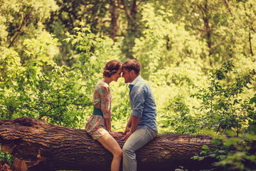 Loving couple resting in summer park