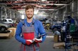 © Nejron Photo - Cheerful serviceman in a car workshop