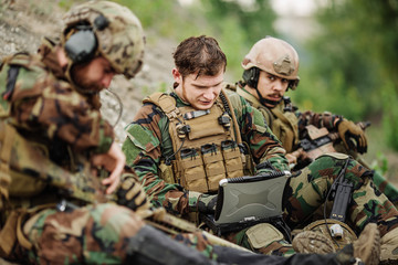 ranger using laptop outdoors