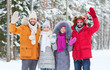 © Syda Productions - group of friends waving hands in winter forest