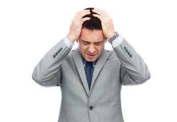 Sticker - businessman in suit having head ache