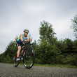 © Westend61 - Germany, Baden-Wuerttemberg, triathlete on bicycle