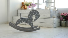 Swaying Wooden Horse On The Floor
