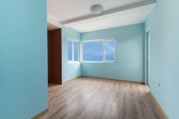 Empty blue room with windows and a door (includes clipping path)