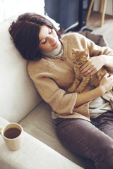 Wall Mural - Woman resting with kitten