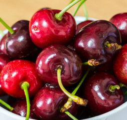 Red Fruit, Handful of a red cherry in a cup