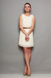 © Voyagerix - Glamour girl in white dress on gray