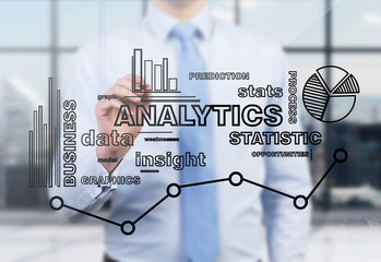 a businessman or an employee is drawing an analytics optimisation chart on the glass screen in a mod