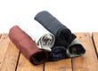 Rolled T Shirts on wood background