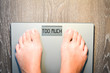 Lose weight concept with person on a scale measuring kilograms