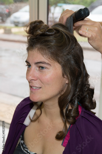 Stylist Pinning Up A Woman S Hairstyle At A Beauty Saloon Buy