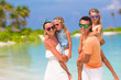 © travnikovstudio - Happy beautiful family on a tropical beach vacation
